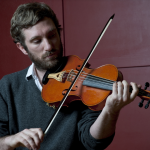 Caoimhín Ó Raghallaigh plays a ten-string fiddle.