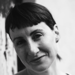 A black-and-white photograph of Róisín Stack. She has short, dark hair.