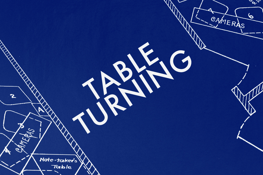 A design based on a diagram of a séance room on a blue background. Text in the centre of the image reads "TABLE TURNING".